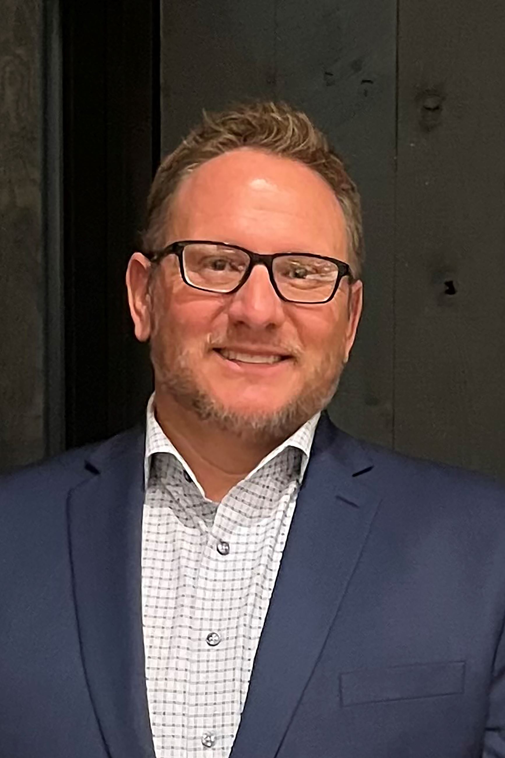 A man wearing glasses.