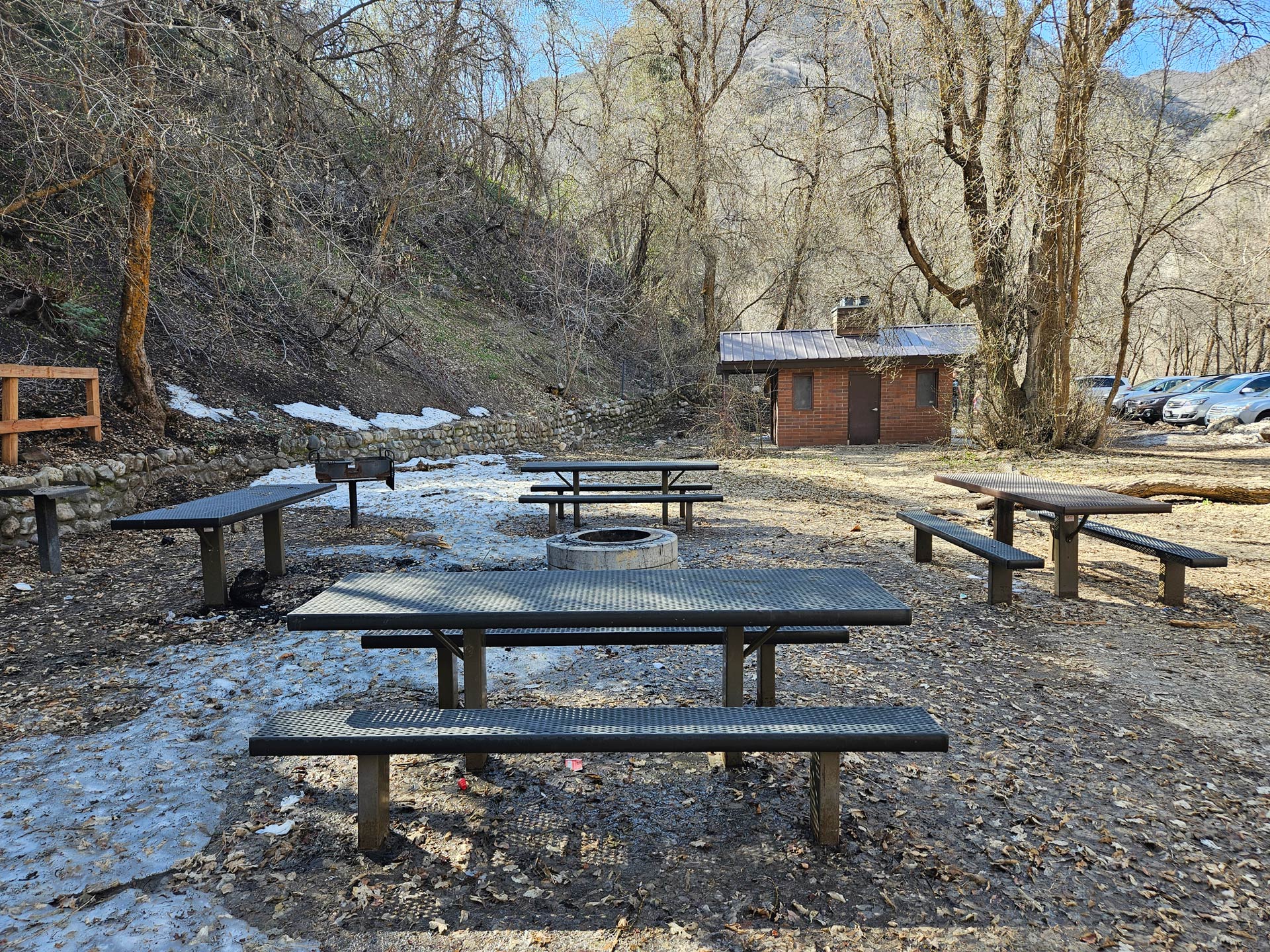 A group of picnic tables in a park.