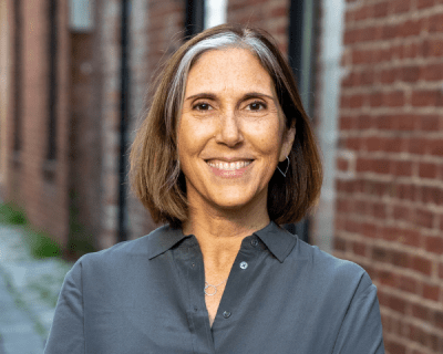 A woman smiling for the camera.