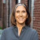 A woman smiling for the camera.