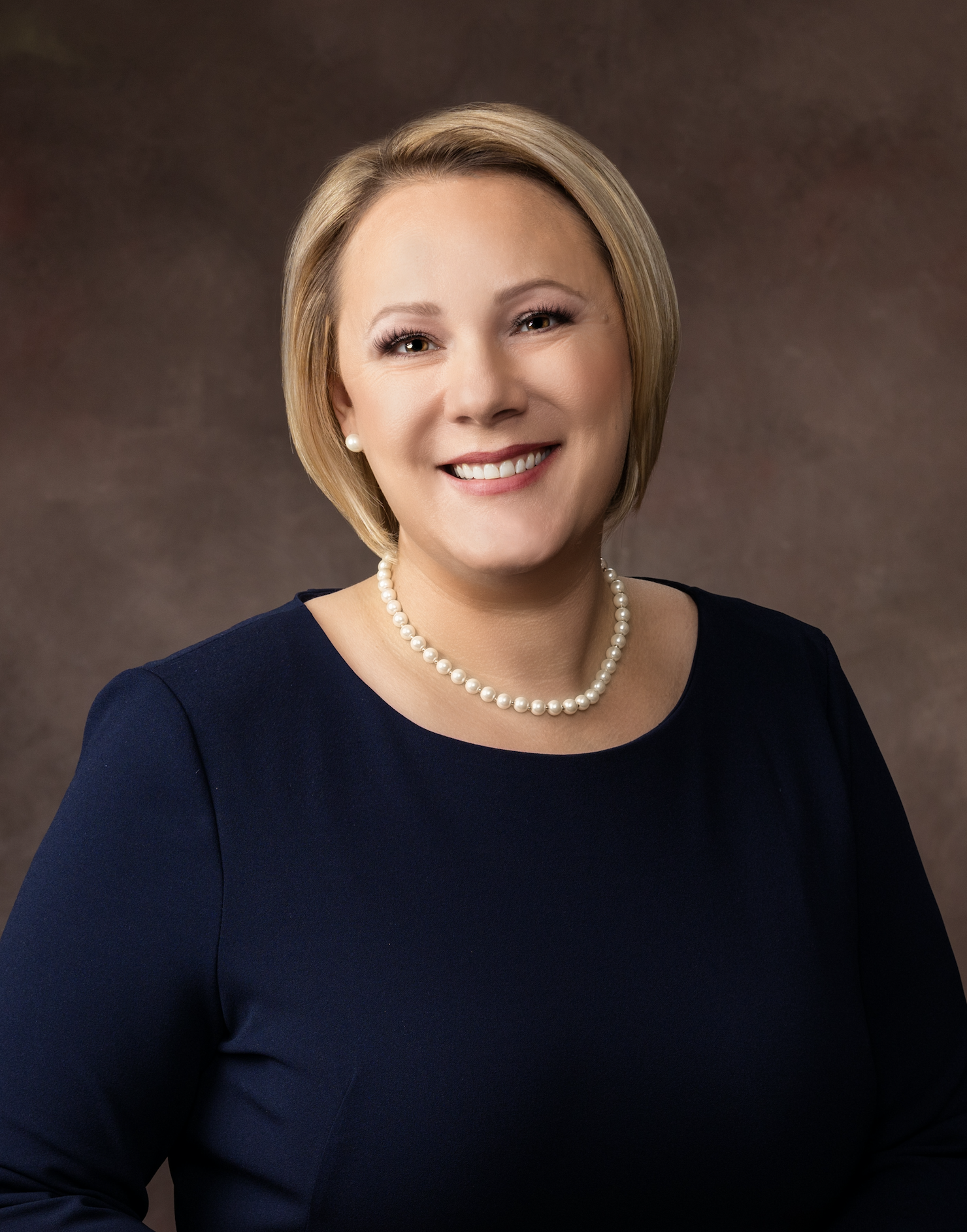 A woman smiling for the camera.