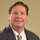 A man wearing a suit and tie.