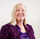 A woman smiling for the camera.