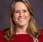 A close-up of a woman smiling.