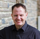 A man smiling for the camera.