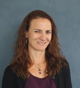 A person smiling for the camera.