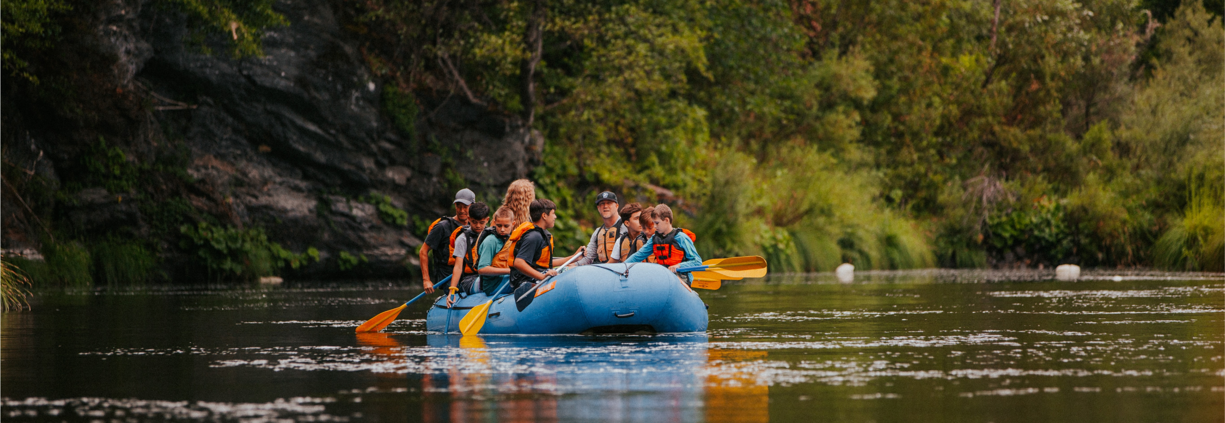 A group of people in a canoe.