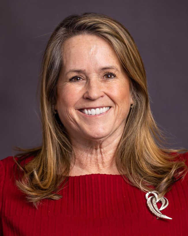 A close-up of a woman smiling.