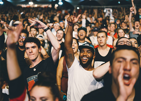 A group of people cheering.