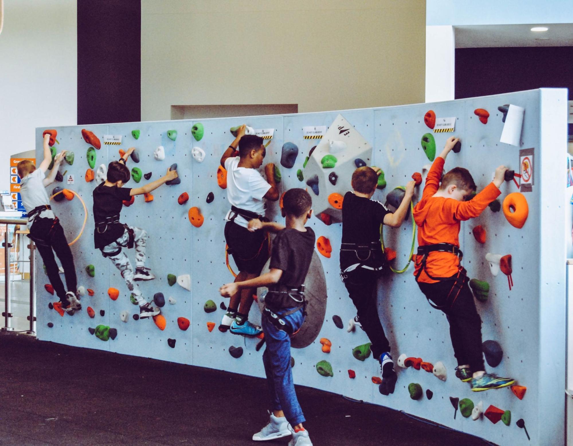A group of people on a wall.