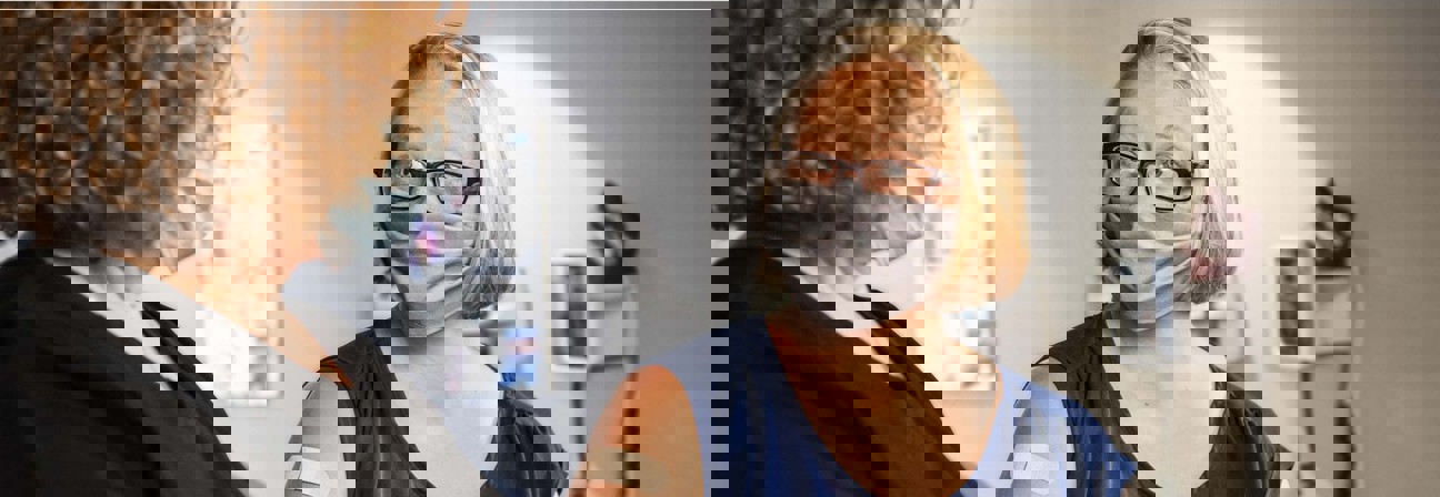 A person looking at another woman.