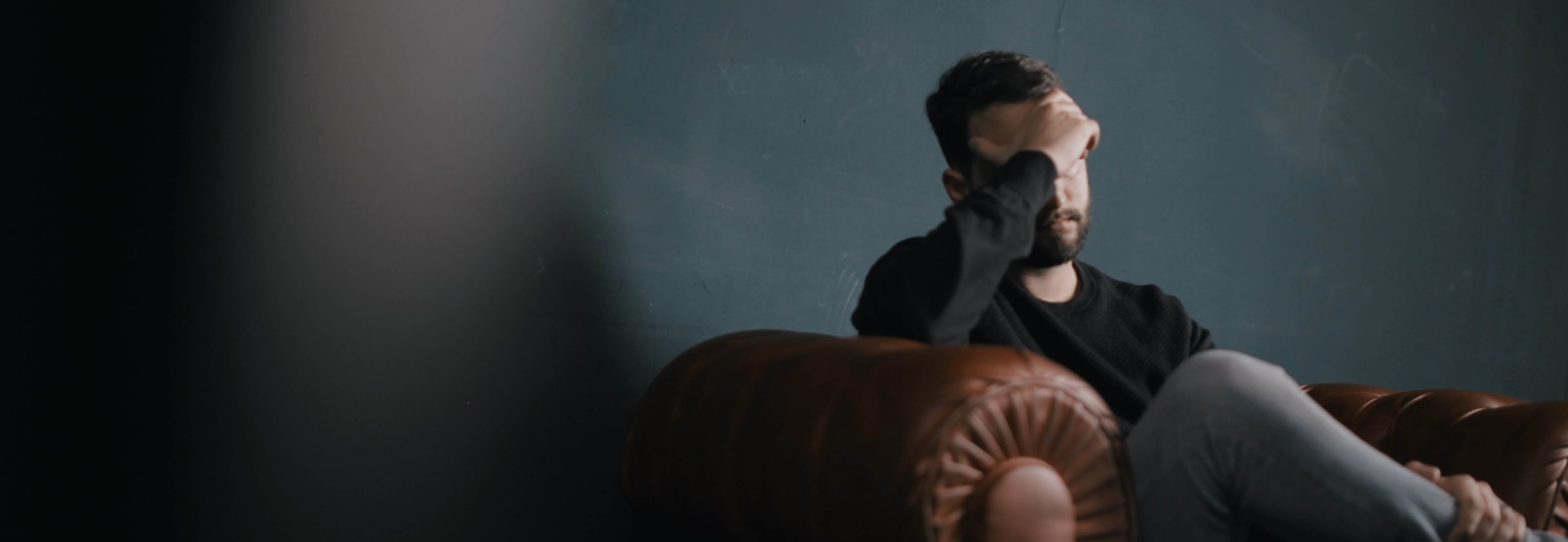 A man sitting on a couch.