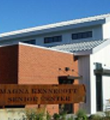 A building with a sign in front.
