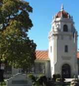 A white building with a red roof.