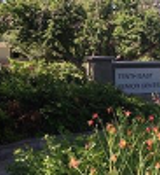 A sign in a garden.