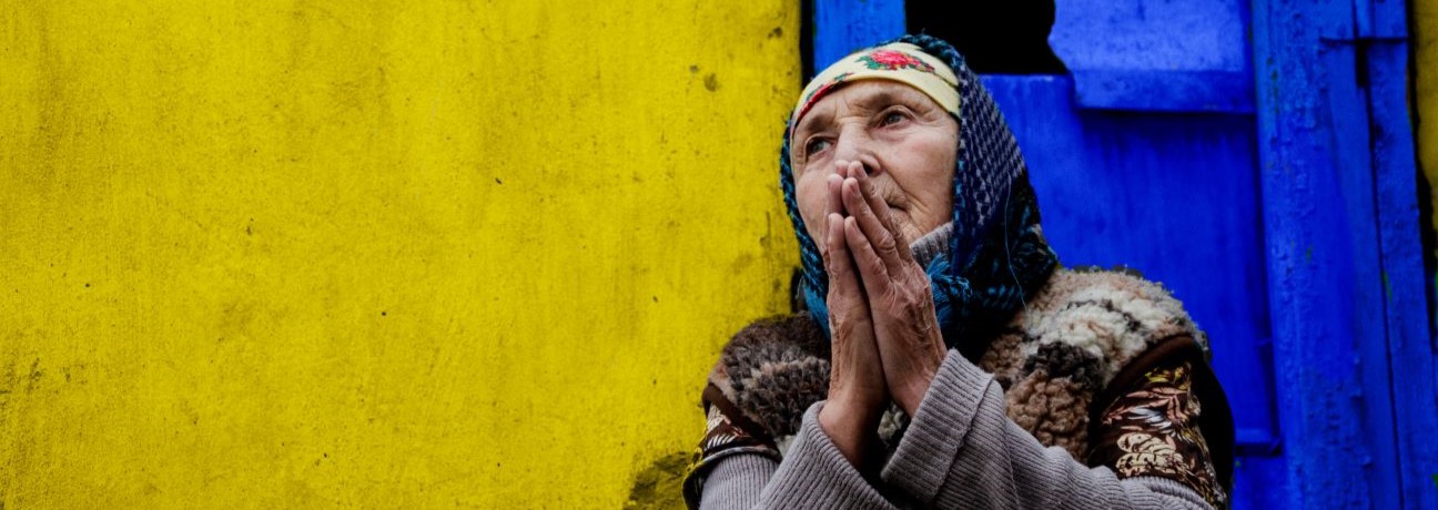 A man with his hand on his face.