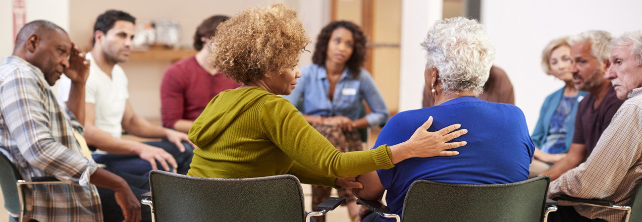 A group of people sitting in chairs.