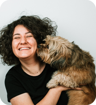 A person holding a dog.