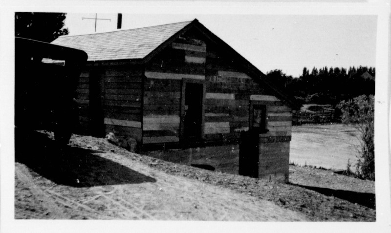 A wooden building with a door.