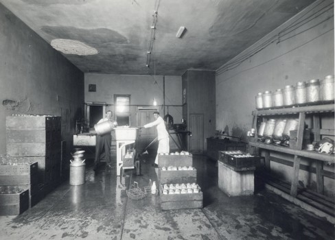 A couple of people working in a factory.