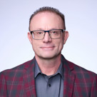 A man wearing glasses.