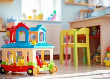 A toy train in a room.