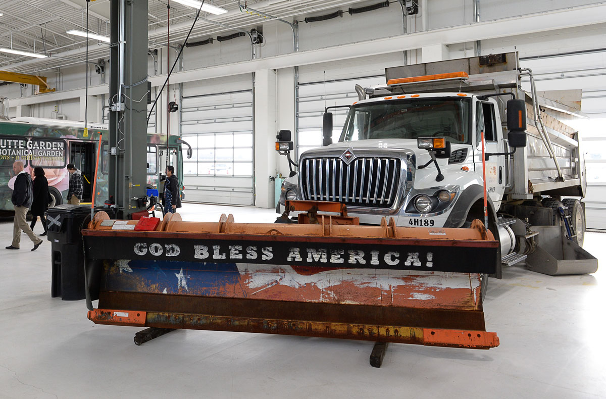 A large truck is parked in a warehouse.