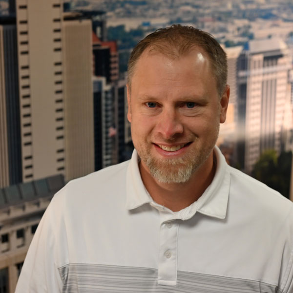 A man smiling for the camera.