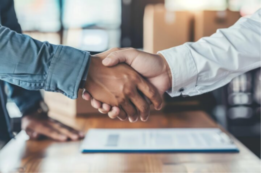 A close-up of people shaking hands.