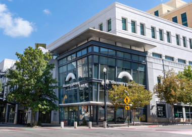 A building with trees and a street.