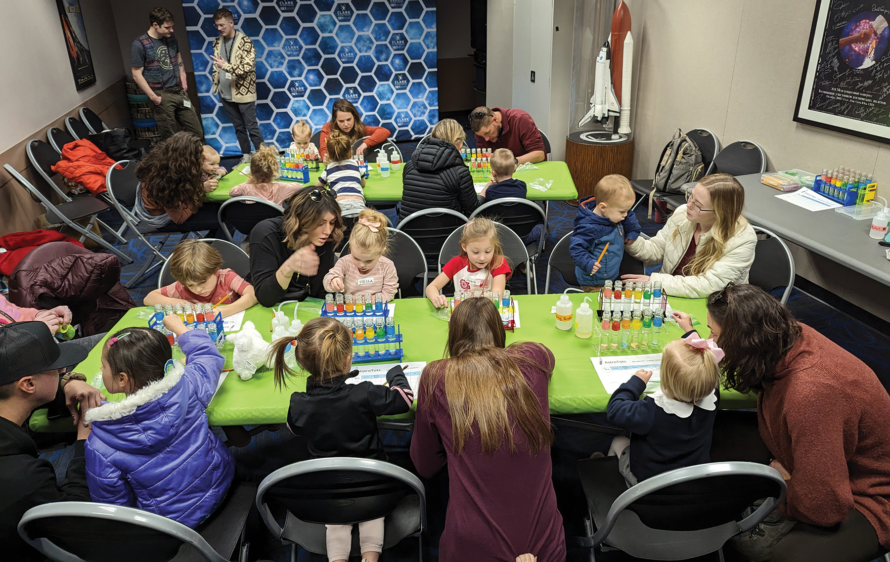 A group of children sitting around a table.