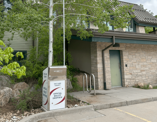 A box on the sidewalk.