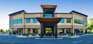 A building with a parking lot.