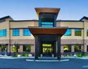 A building with a parking lot.