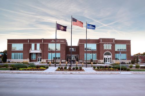 A building with flags in front of it.