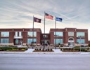 A building with flags in front of it.