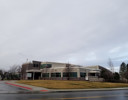 A building with a parking lot.