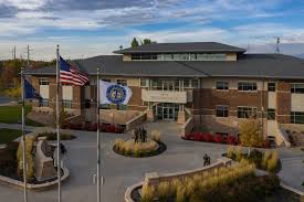 A building with a flag in front.