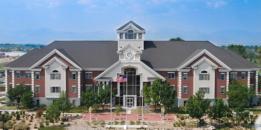 A large building with a flag on the roof.