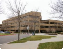 A building with trees in front.