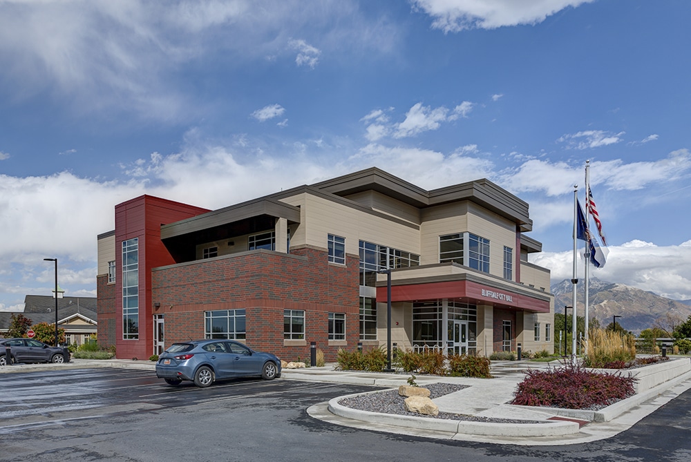 A building with a flag in front.