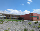 A building with a gravel lot.