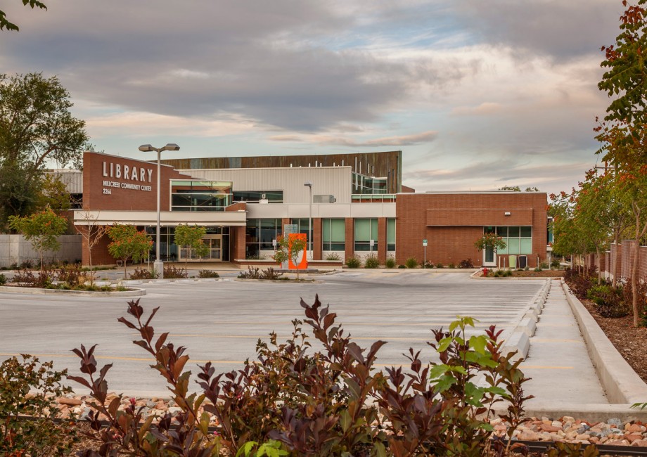 A building with a fountain in front.