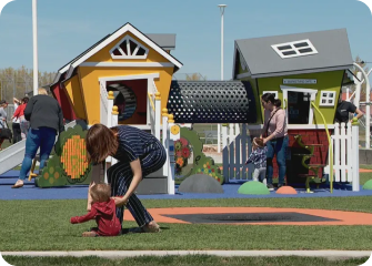 A person and a child playing in a park.