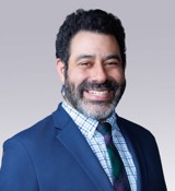 A man smiling for the camera.