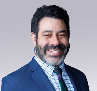 A man smiling for the camera.