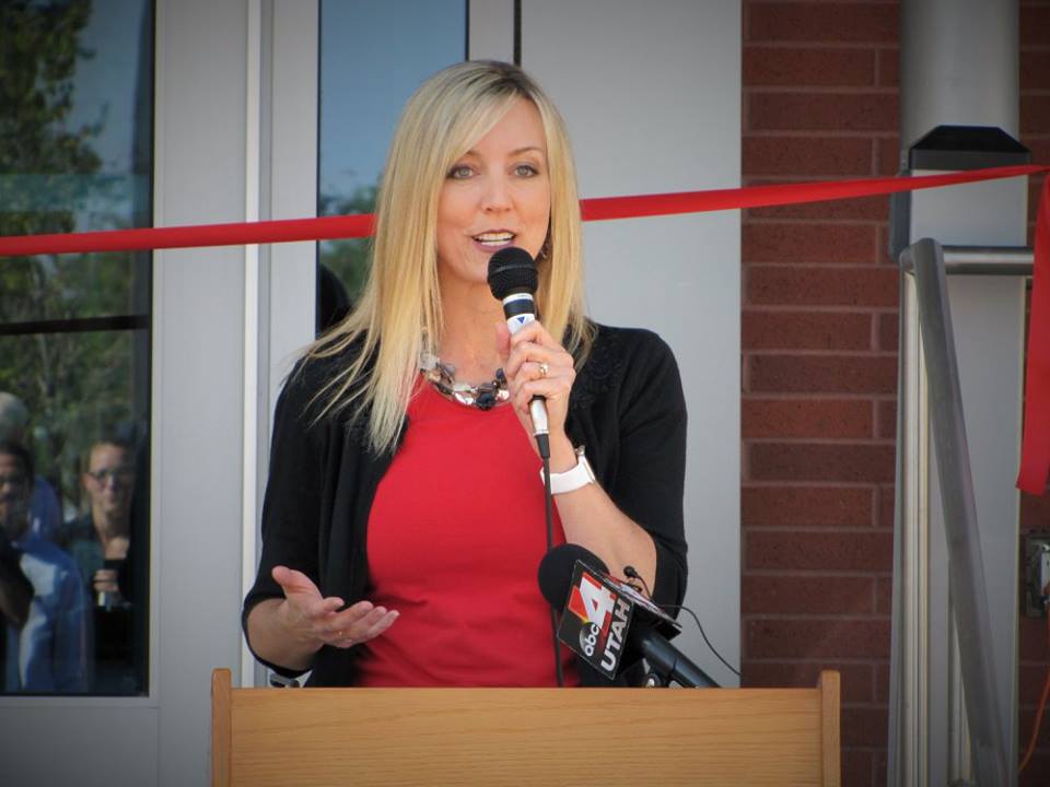 Aimee Winder Newton speaking into a microphone.