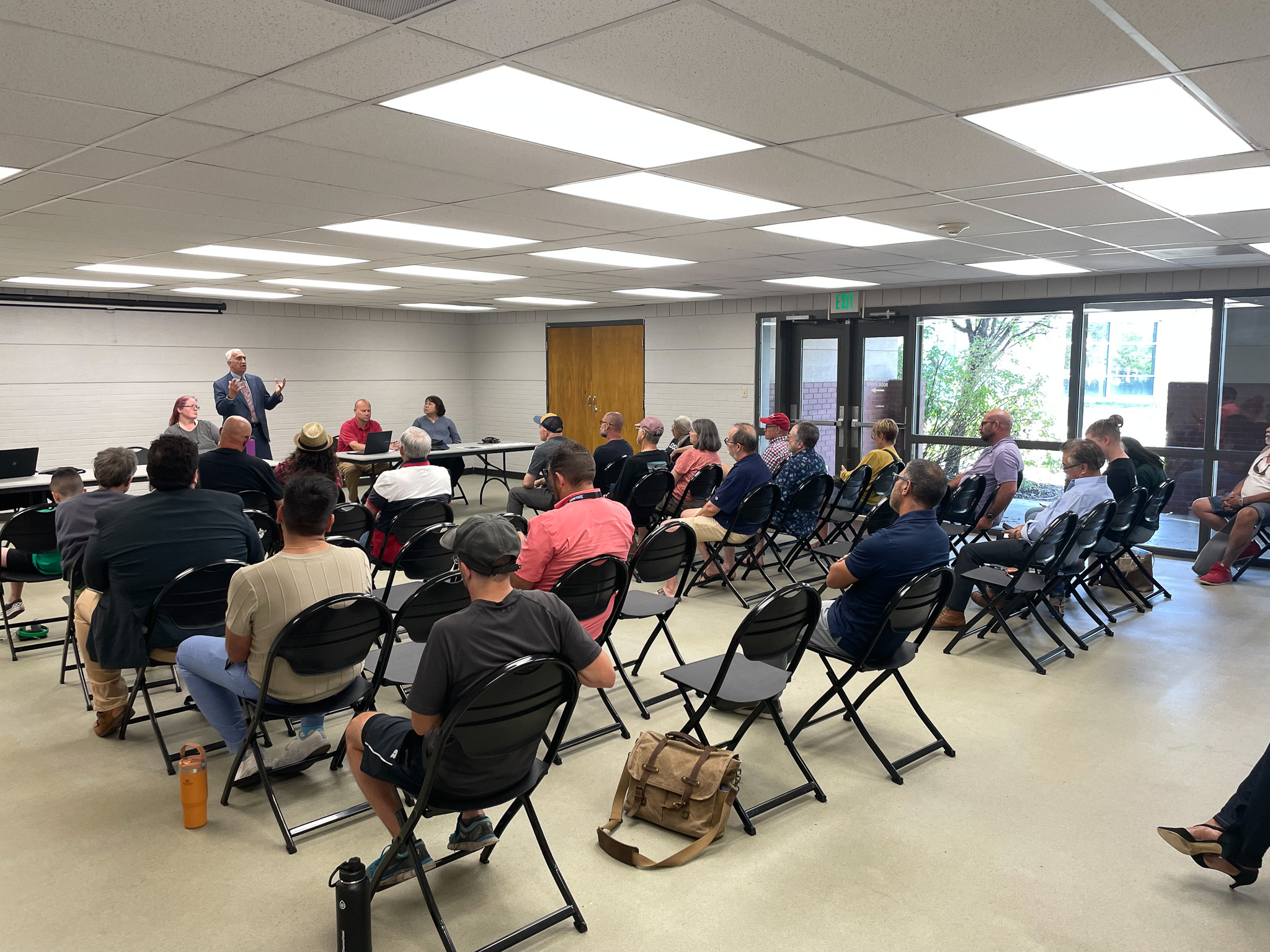 A group of people sitting in chairs.