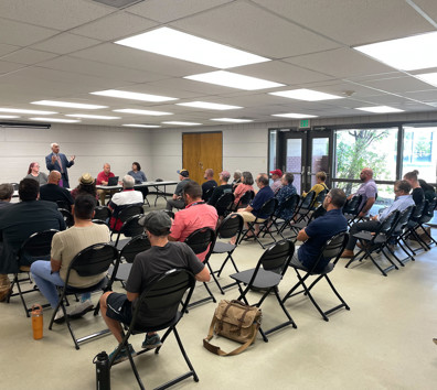 A group of people sitting in chairs.