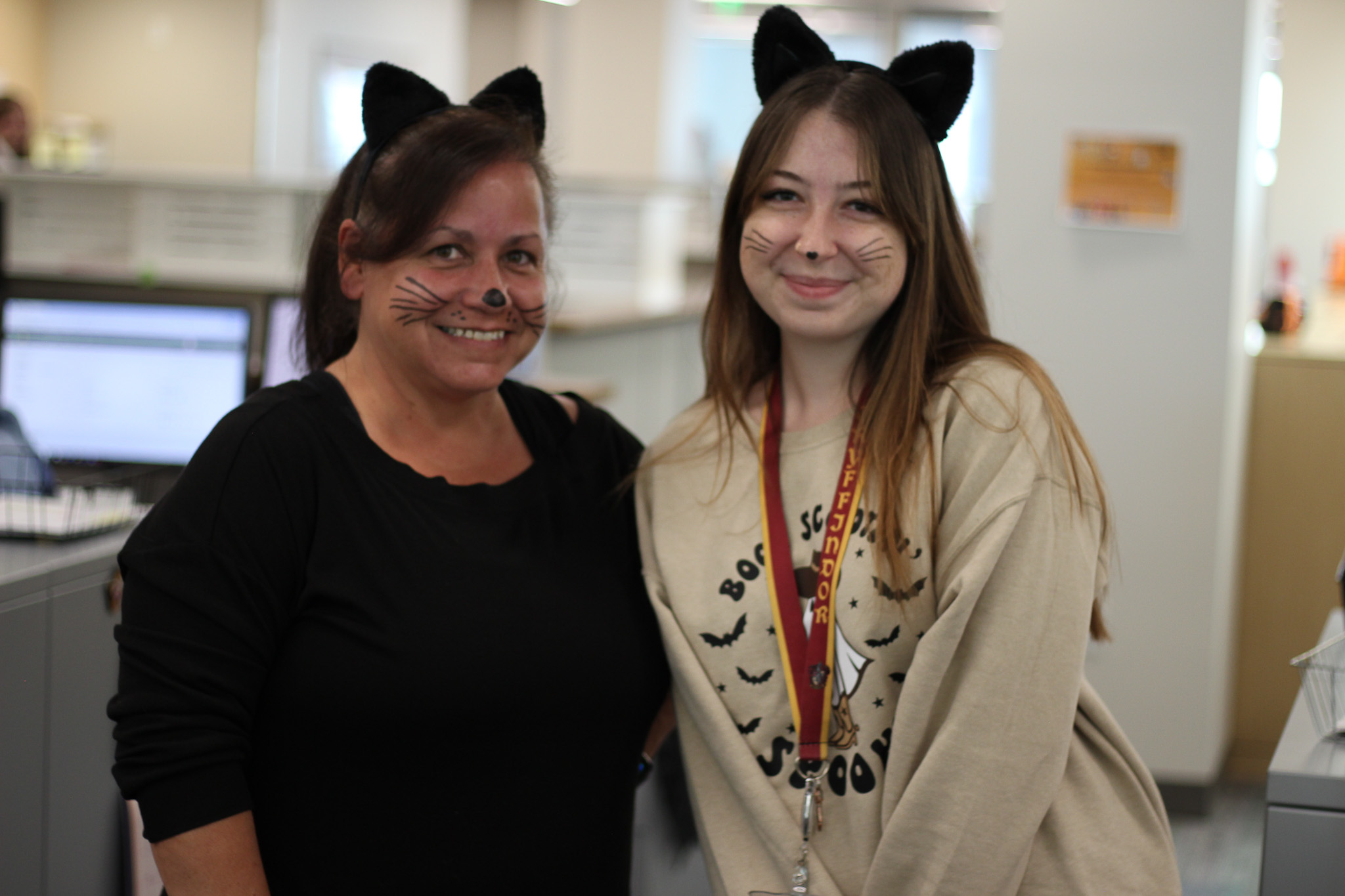 A couple of women smiling.